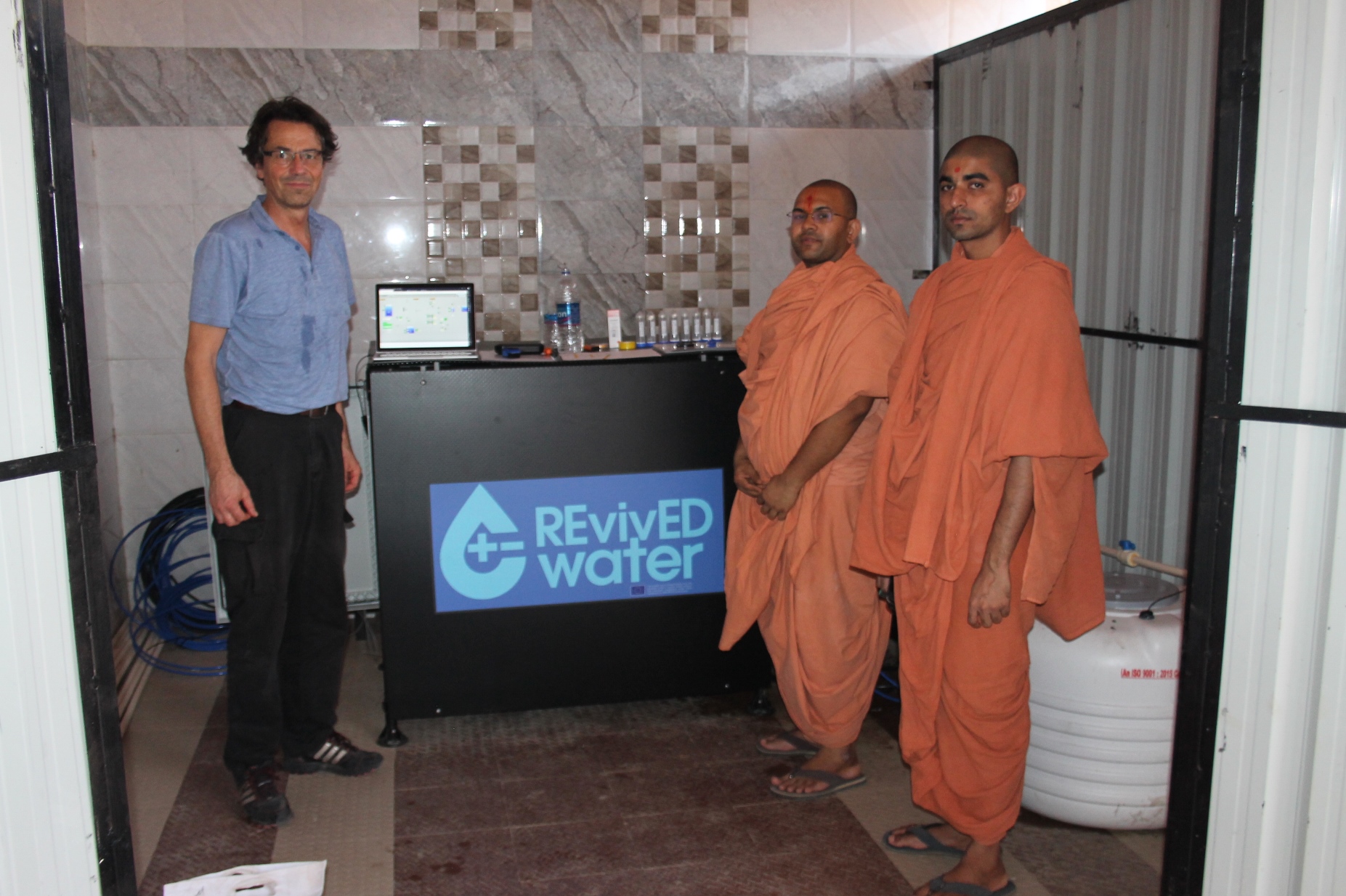 Hindu monks visit the installation.